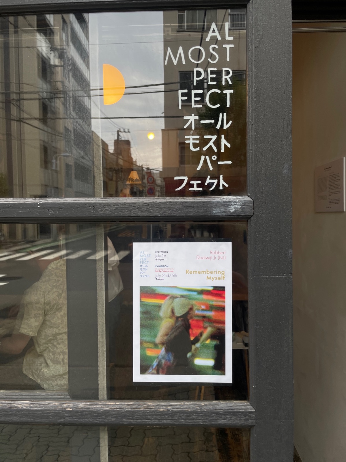 The exhibition poster in the window of a gallery